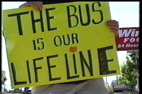 protest sign says the bus is our lifeline