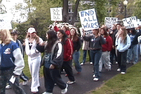 marchers with signs and disabilities and allies